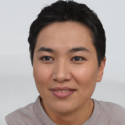 Joyful asian young-adult female with short  black hair and brown eyes