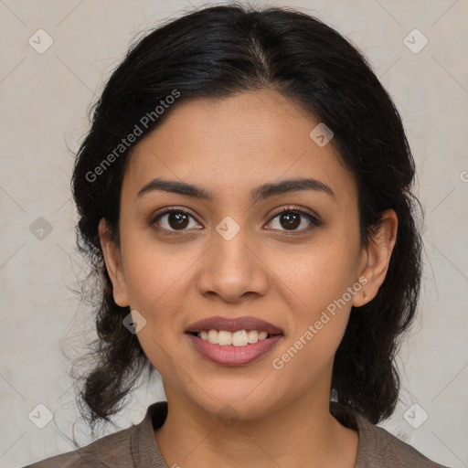 Joyful latino young-adult female with medium  brown hair and brown eyes