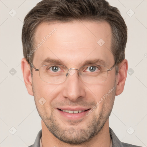 Joyful white adult male with short  brown hair and brown eyes