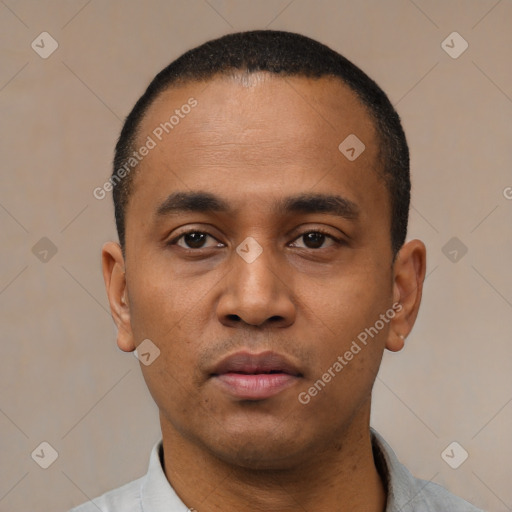 Neutral latino young-adult male with short  black hair and brown eyes