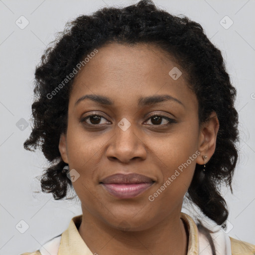 Joyful black adult female with short  brown hair and brown eyes