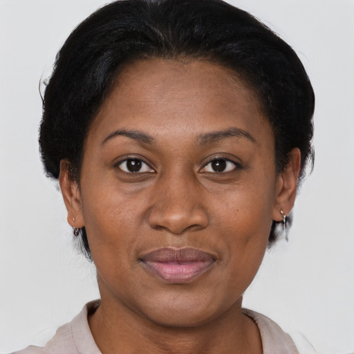 Joyful latino adult female with short  brown hair and brown eyes