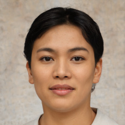 Joyful asian young-adult female with short  black hair and brown eyes