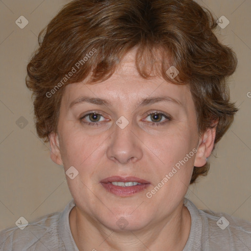 Joyful white adult female with medium  brown hair and blue eyes