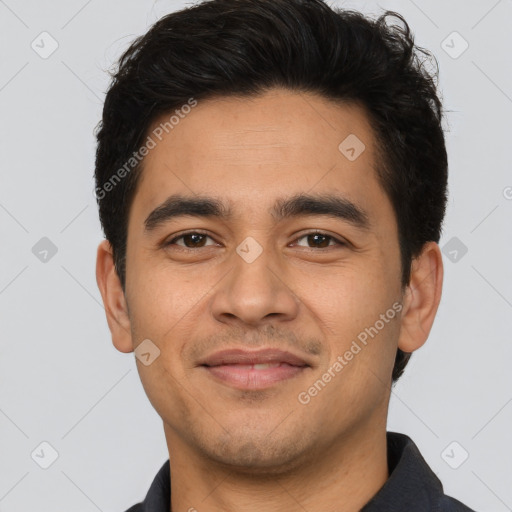 Joyful latino young-adult male with short  brown hair and brown eyes