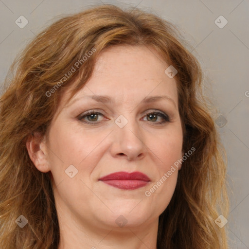 Joyful white adult female with long  brown hair and brown eyes