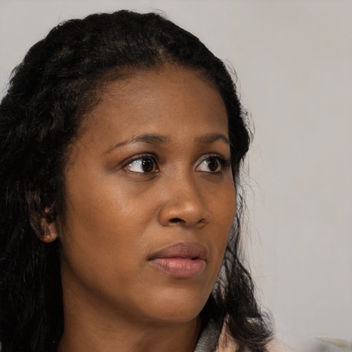 Neutral black young-adult female with long  black hair and brown eyes