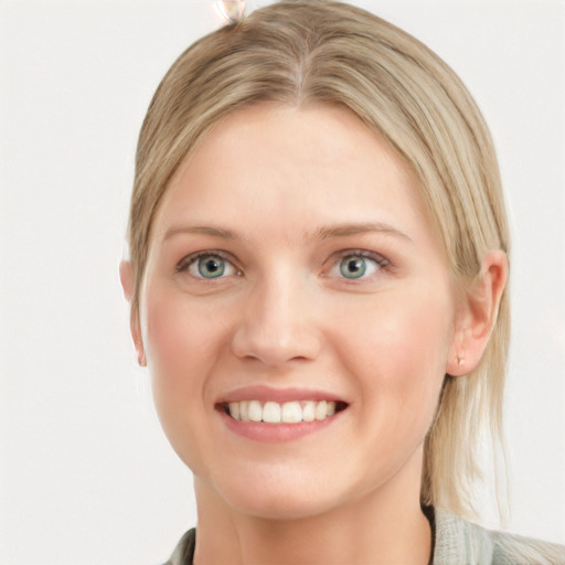 Joyful white young-adult female with medium  brown hair and blue eyes