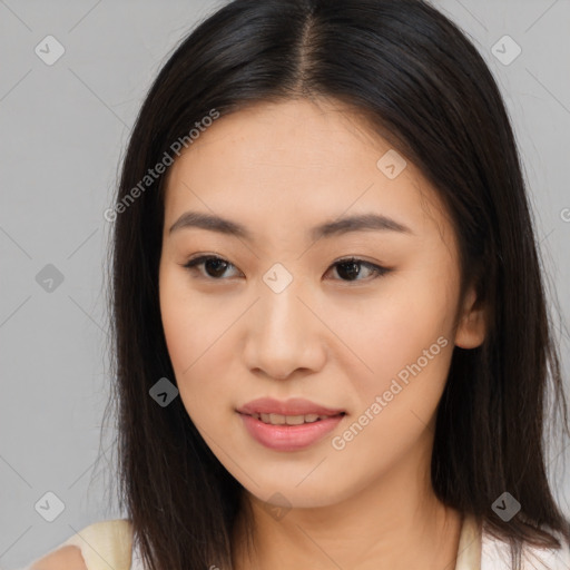 Joyful asian young-adult female with long  brown hair and brown eyes