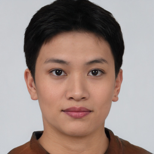 Joyful asian young-adult female with short  black hair and brown eyes