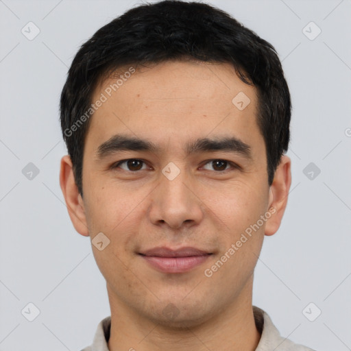 Joyful white young-adult male with short  black hair and brown eyes