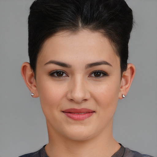 Joyful white young-adult female with short  brown hair and brown eyes