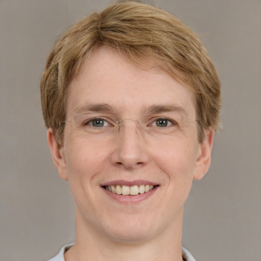 Joyful white adult male with short  brown hair and grey eyes