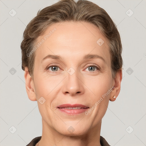 Joyful white adult female with short  brown hair and grey eyes