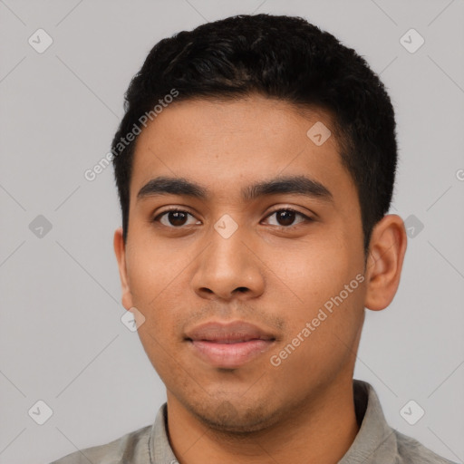 Neutral latino young-adult male with short  black hair and brown eyes