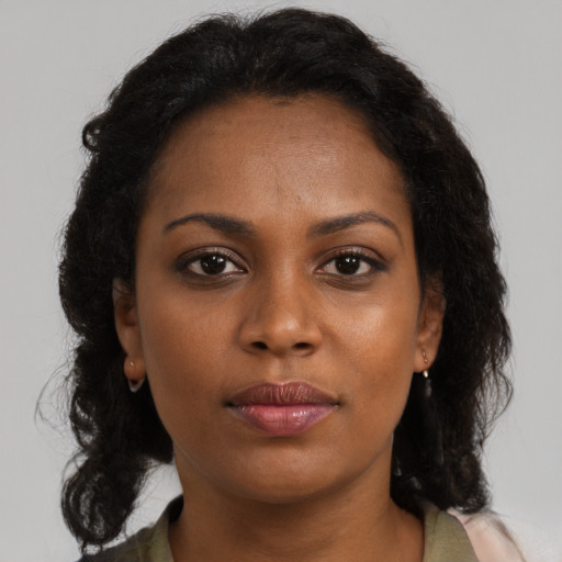Neutral black young-adult female with medium  brown hair and brown eyes
