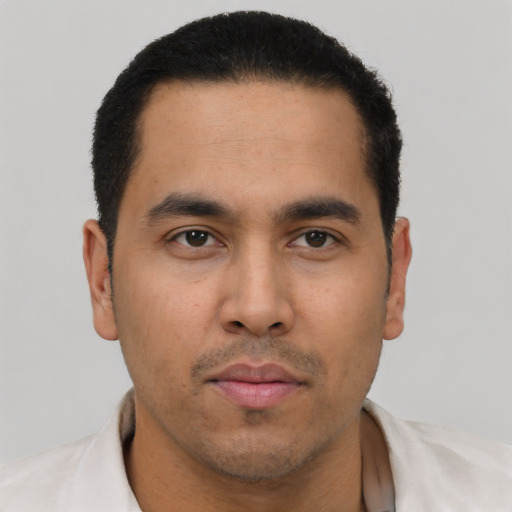 Neutral latino young-adult male with short  black hair and brown eyes