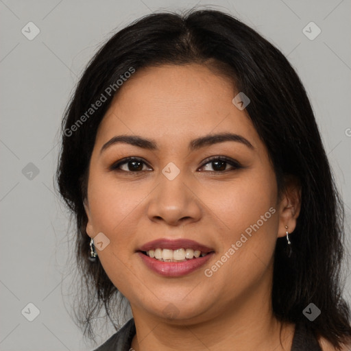 Joyful latino young-adult female with medium  brown hair and brown eyes