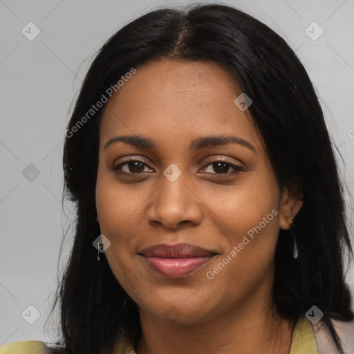 Joyful black young-adult female with long  black hair and brown eyes