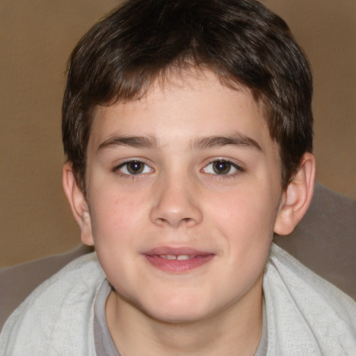 Joyful white child male with short  brown hair and brown eyes