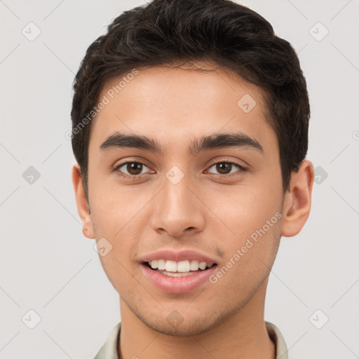 Joyful white young-adult male with short  brown hair and brown eyes