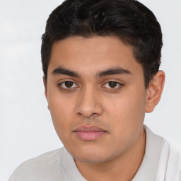 Neutral latino young-adult male with short  brown hair and brown eyes
