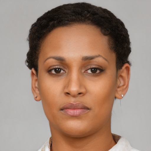 Neutral latino young-adult female with short  brown hair and brown eyes