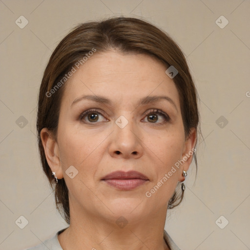 Joyful white adult female with medium  brown hair and brown eyes