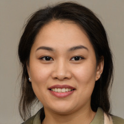 Joyful white young-adult female with medium  brown hair and brown eyes