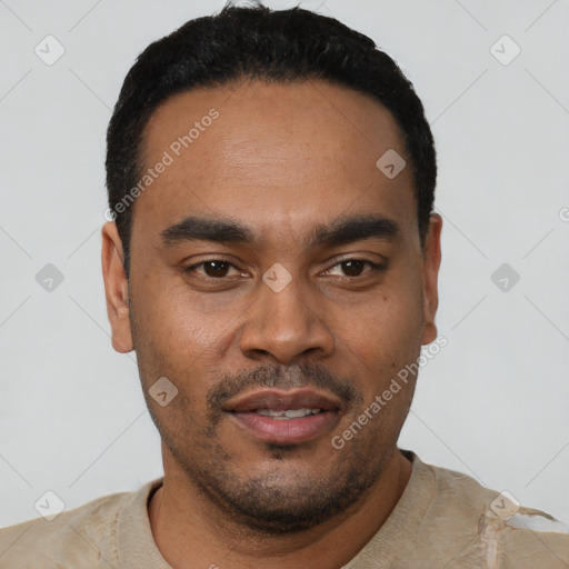 Joyful latino young-adult male with short  black hair and brown eyes