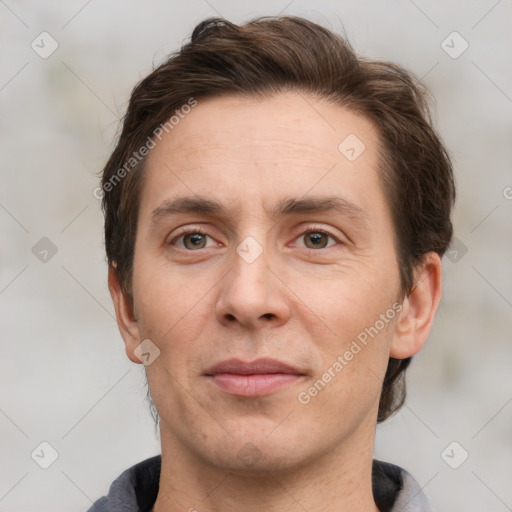 Joyful white adult male with short  brown hair and grey eyes