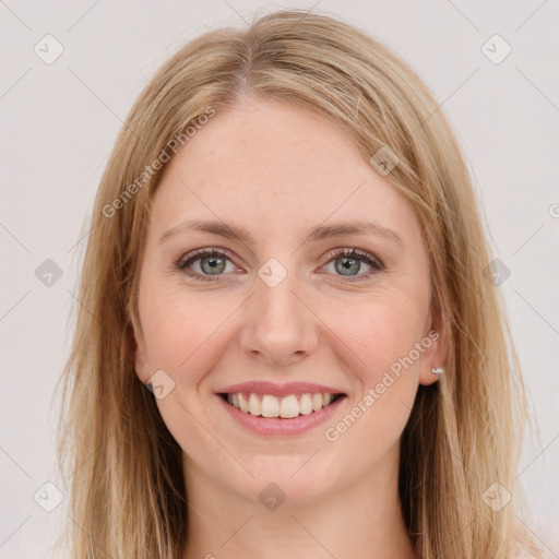 Joyful white young-adult female with long  brown hair and green eyes