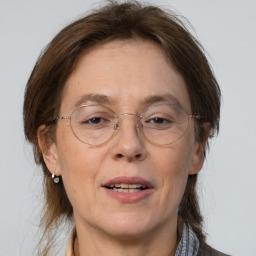 Joyful white middle-aged female with medium  brown hair and brown eyes