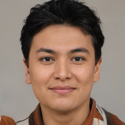 Joyful latino young-adult male with short  brown hair and brown eyes