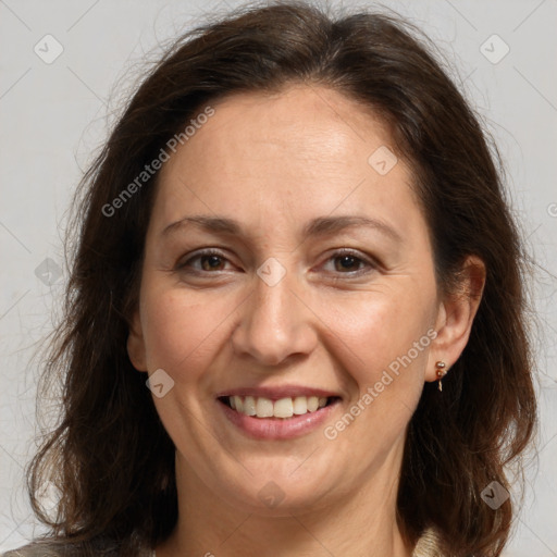 Joyful white adult female with medium  brown hair and grey eyes