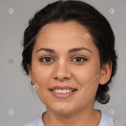 Joyful latino adult female with medium  brown hair and brown eyes