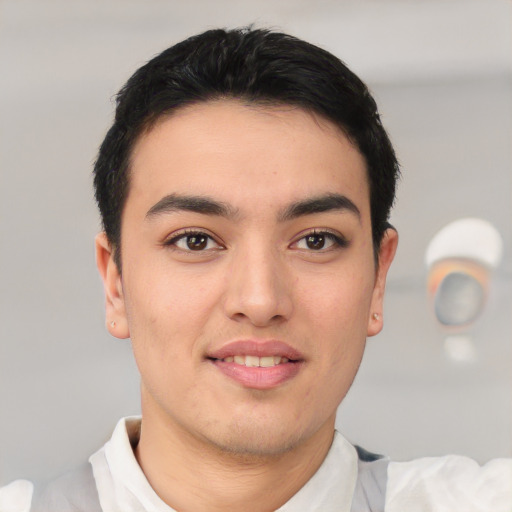 Joyful asian young-adult male with short  brown hair and brown eyes