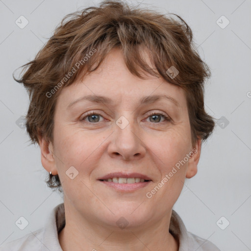 Joyful white adult female with short  brown hair and brown eyes