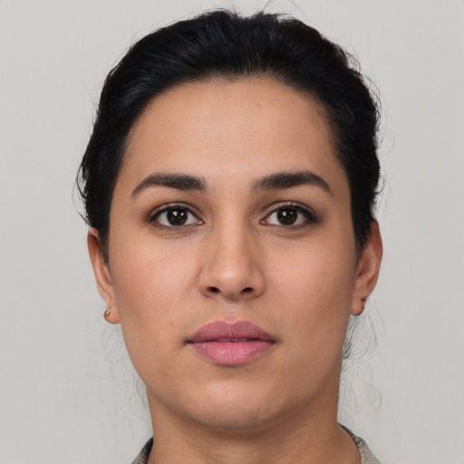 Neutral latino young-adult female with short  brown hair and brown eyes