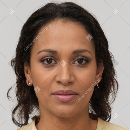 Joyful black adult female with medium  brown hair and brown eyes