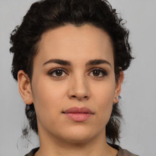 Neutral white young-adult female with short  brown hair and brown eyes