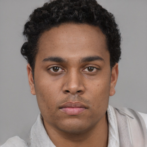 Neutral black young-adult male with short  brown hair and brown eyes