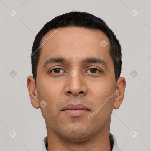 Neutral latino young-adult male with short  black hair and brown eyes