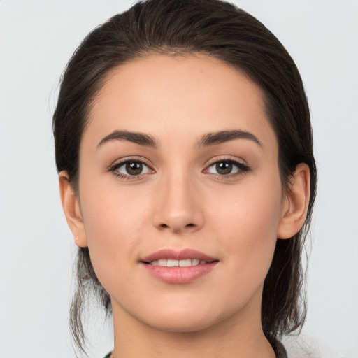 Joyful white young-adult female with medium  brown hair and brown eyes