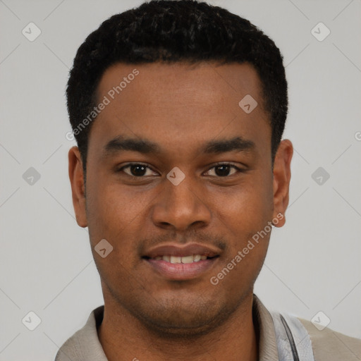 Joyful black young-adult male with short  black hair and brown eyes