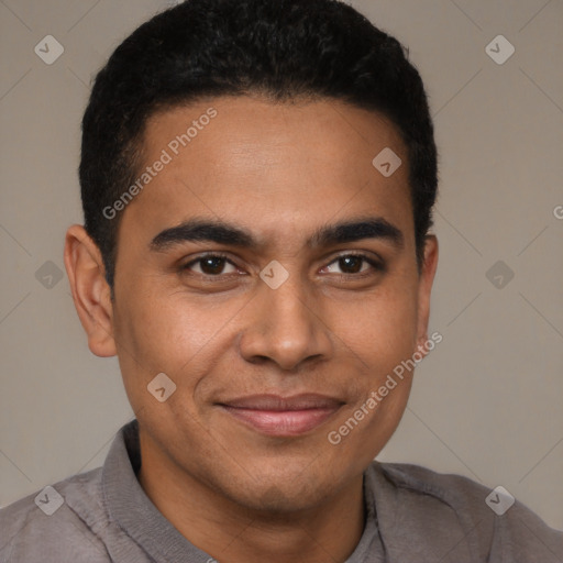 Joyful latino young-adult male with short  brown hair and brown eyes