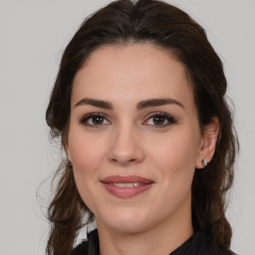 Joyful white young-adult female with medium  brown hair and brown eyes