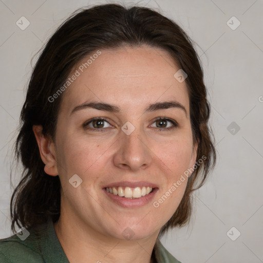 Joyful white adult female with medium  brown hair and green eyes