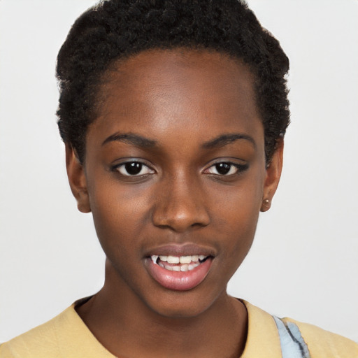 Joyful black young-adult female with short  black hair and brown eyes