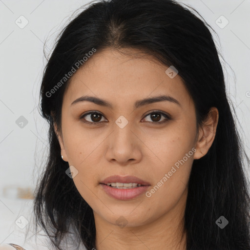 Joyful asian young-adult female with long  brown hair and brown eyes